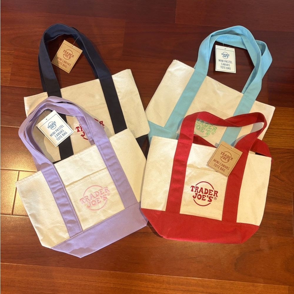 BNWT.  Never been used.  4 Trader Joe’s mini totes.  All 4 for $40.